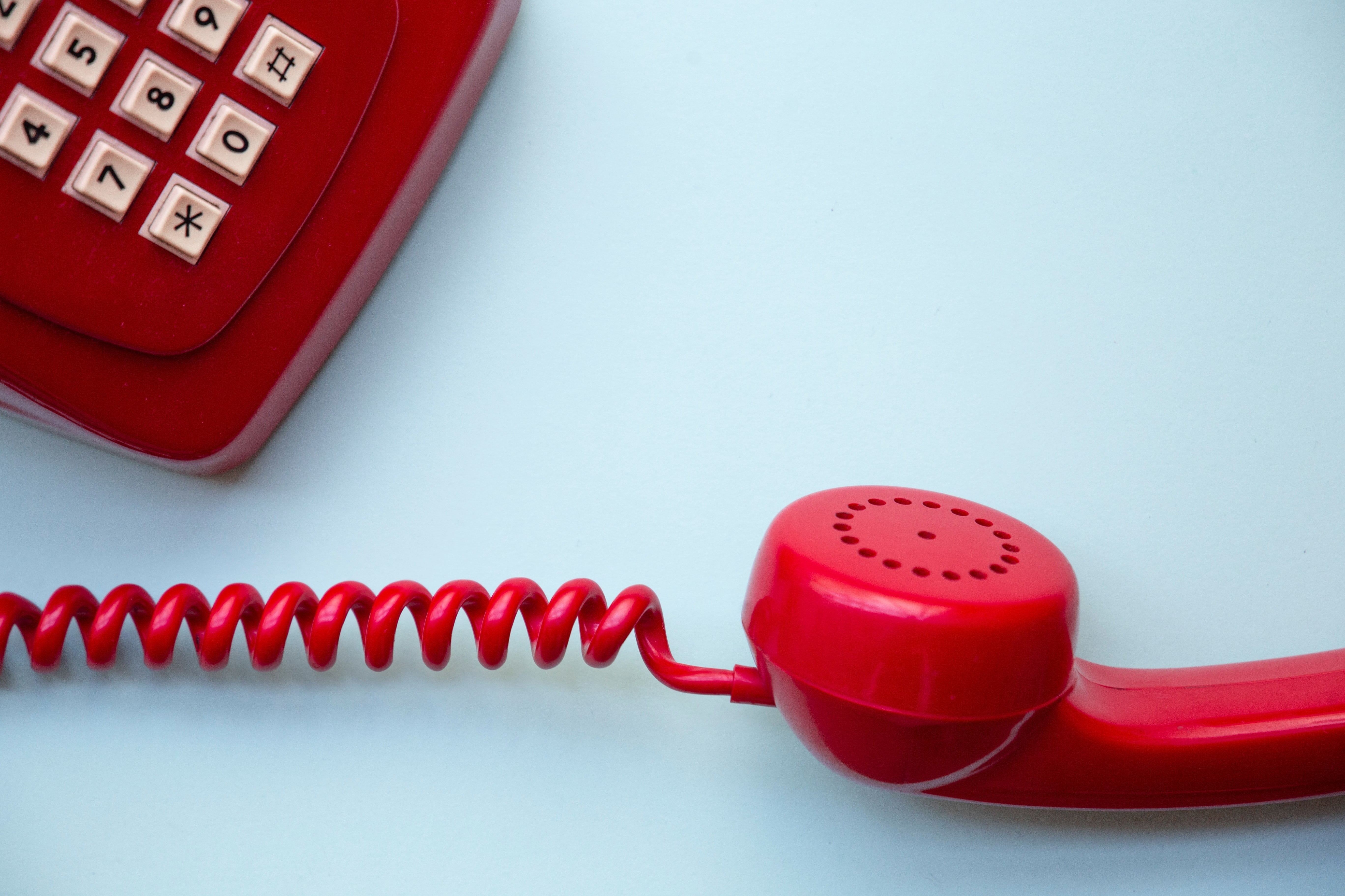 A red old-fashioned telephone