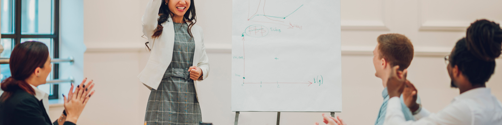Asian businesswoman holding a meeting to her diverse colleagues in an office