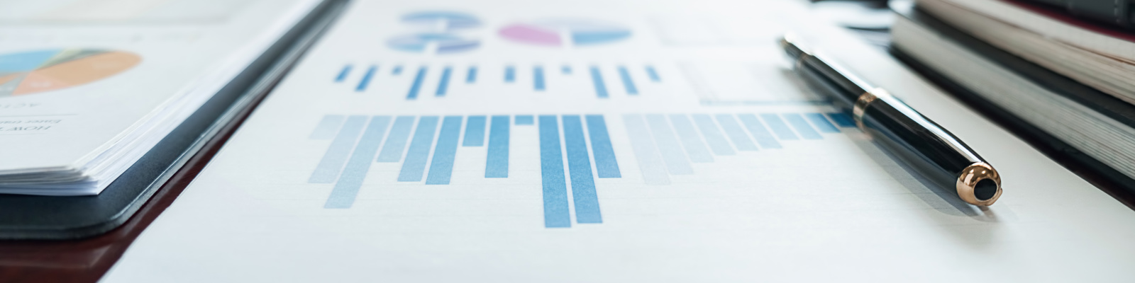 Photo of a document and report with graphs and information for benchmarking.