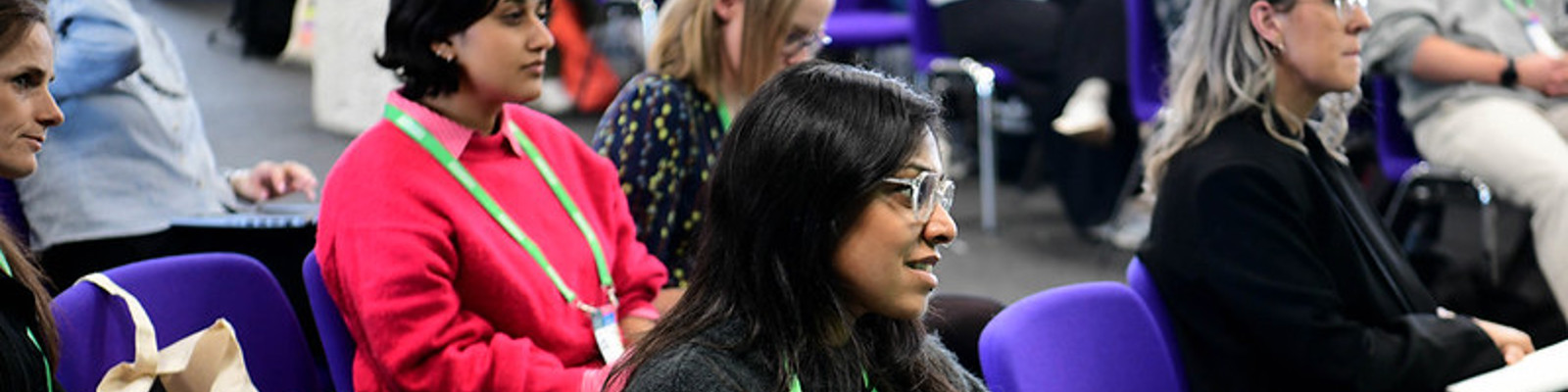 Delegates sat in a session at Fundraising Convention 2025, taking notes