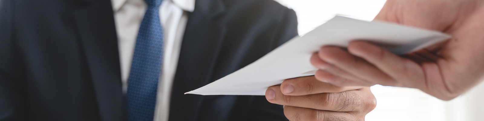 Close up view of office worker receiving salary from boss.