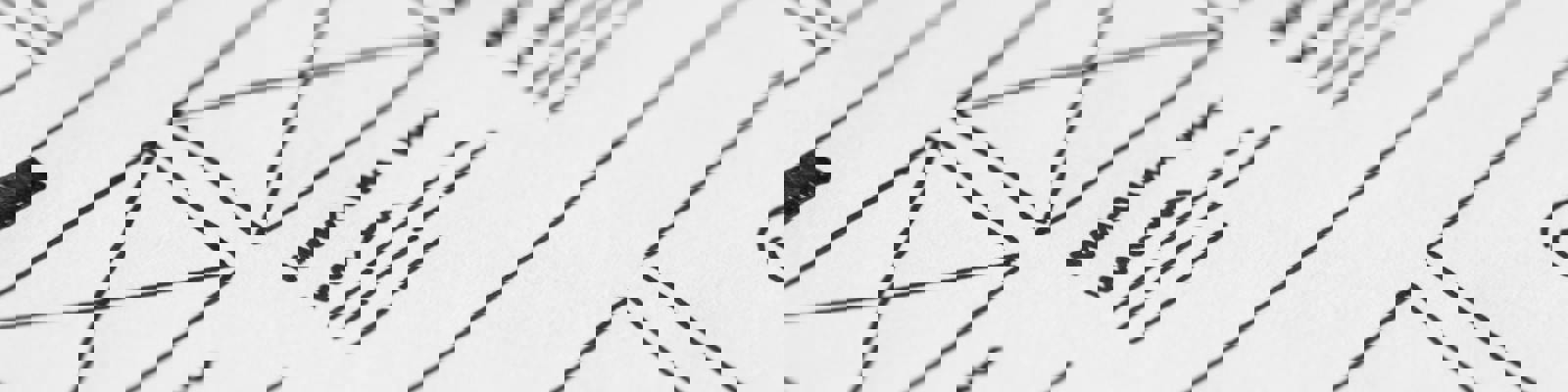 A piece of white paper with a line drawing of some envelopes and sample text underneath